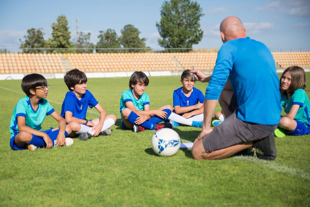 soccer coach analyzing data